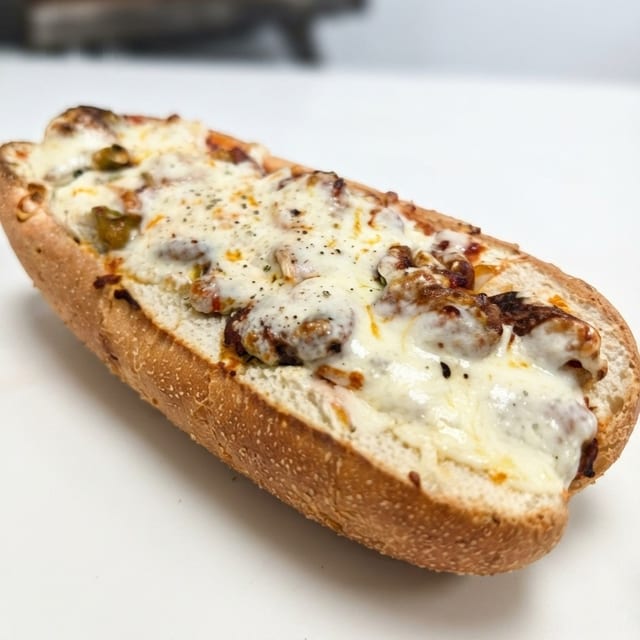 LARGE SAUSAGE, ONION & PEPPER PARM SUB.