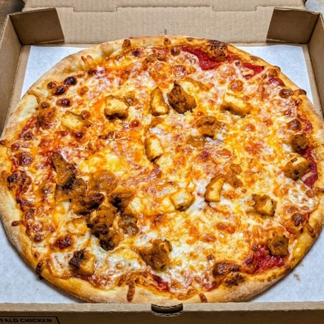 LARGE CHICKEN PARM PIZZA.