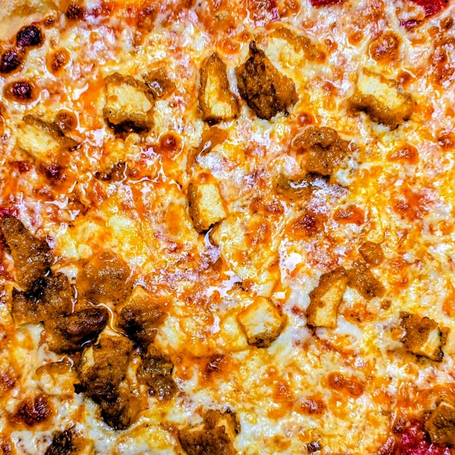 LARGE CHICKEN PARM PIZZA.